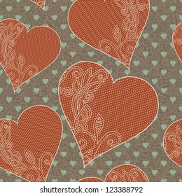 Seamless pattern with lace designed hearts on textured wallpaper