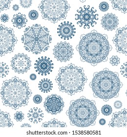 Seamless pattern with laced snowflakes