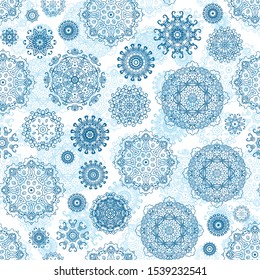 Seamless pattern with laced snowflakes