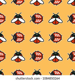 Seamless pattern with ladybirds and beetles on yellow background