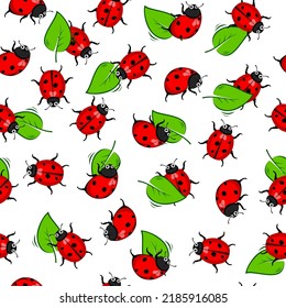 Seamless pattern with ladybugs and green leaves