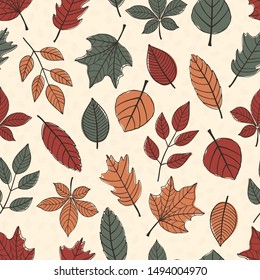Seamless pattern of large autumn leaves on a cream background