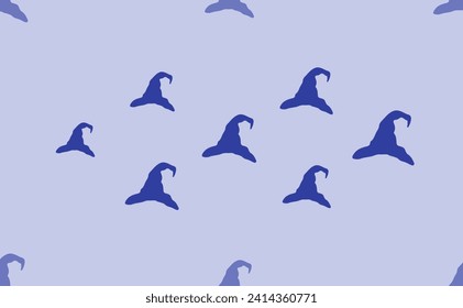 Seamless pattern of large isolated blue wizard hat symbols. The pattern is divided by a line of elements of lighter tones. Vector illustration on light blue background