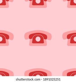 Seamless pattern of large isolated red vintage telephone symbols. The elements are evenly spaced. Vector illustration on light red background
