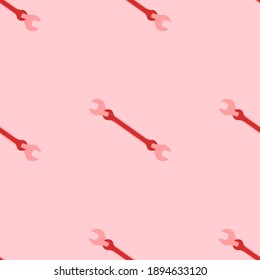 Seamless pattern of large isolated red wrench symbols. The elements are evenly spaced. Vector illustration on light red background