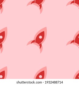 Seamless pattern of large isolated red rocket symbols. The elements are evenly spaced. Vector illustration on light red background