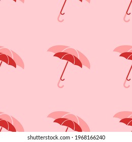 Seamless pattern of large isolated red umbrella symbols. The elements are evenly spaced. Vector illustration on light red background