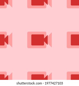 Seamless pattern of large isolated red video camera symbols. The elements are evenly spaced. Vector illustration on light red background