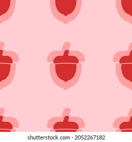 Seamless pattern of large isolated red acorn symbols. The elements are evenly spaced. Vector illustration on light red background
