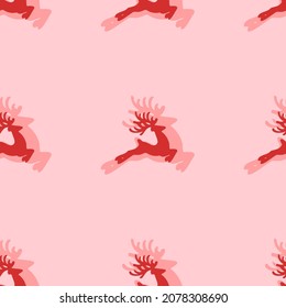 Seamless pattern of large isolated red Christmas deers. The elements are evenly spaced. Vector illustration on light red background