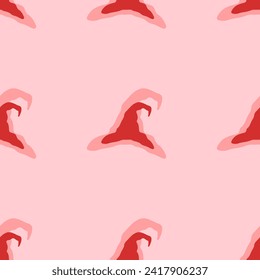 Seamless pattern of large isolated red wizard hat symbols. The elements are evenly spaced. Vector illustration on light red background