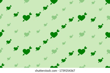 Seamless pattern of large and small green cupid arrow symbols. The elements are arranged in a wavy. Vector illustration on light green background
