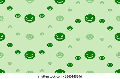 Seamless pattern of large and small green halloween pumpkin symbols. The elements are arranged in a wavy. Vector illustration on light green background