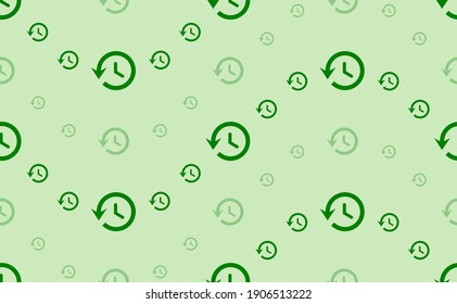 Seamless pattern of large and small green time back symbols. The elements are arranged in a wavy. Vector illustration on light green background