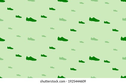 Seamless pattern of large and small green football boot symbols. The elements are arranged in a wavy. Vector illustration on light green background