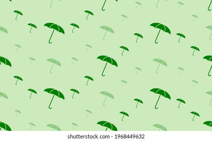 Seamless pattern of large and small green umbrella symbols. The elements are arranged in a wavy. Vector illustration on light green background