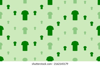 Seamless pattern of large and small green t-shirt symbols. The elements are arranged in a wavy. Vector illustration on light green background