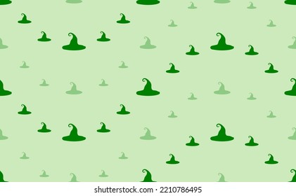Seamless pattern of large and small green witch hat symbols. The elements are arranged in a wavy. Vector illustration on light green background