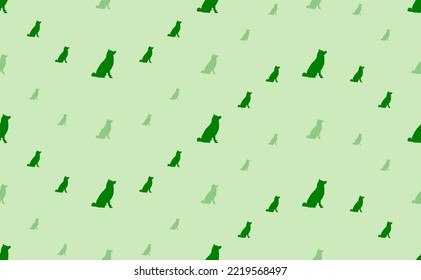 Seamless pattern of large and small green dog symbols. The elements are arranged in a wavy. Vector illustration on light green background