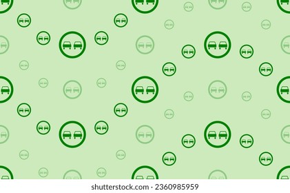 Seamless pattern of large and small green no overtaking signs. The elements are arranged in a wavy. Vector illustration on light green background