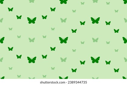 Seamless pattern of large and small green butterfly symbols. The elements are arranged in a wavy. Vector illustration on light green background