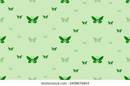 Seamless pattern of large and small green butterfly symbols. The elements are arranged in a wavy. Vector illustration on light green background