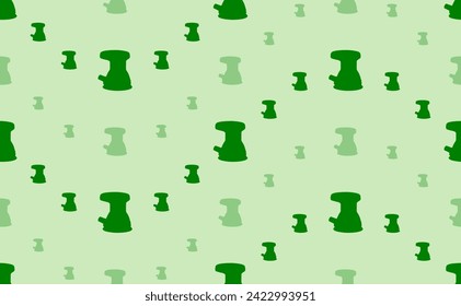 Seamless pattern of large and small green sanding machine symbols. The elements are arranged in a wavy. Vector illustration on light green background