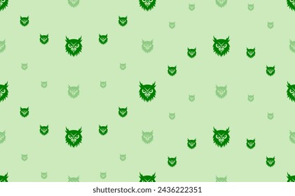 Seamless pattern of large and small green owl head symbols. The elements are arranged in a wavy. Vector illustration on light green background
