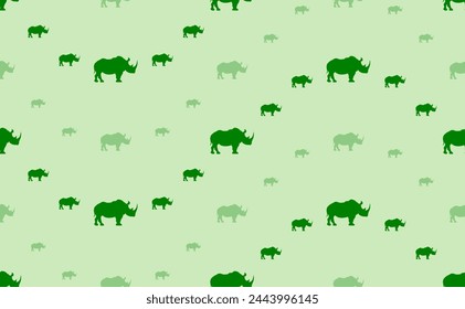 Seamless pattern of large and small green rhino symbols. The elements are arranged in a wavy. Vector illustration on light green background