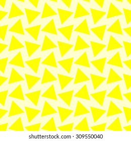 Seamless pattern with large triangles in different directions bright yellow on a pale lemon yellow background