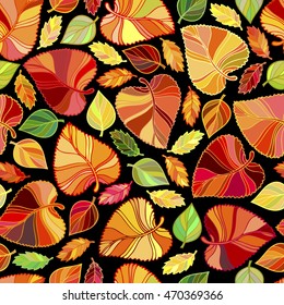 seamless pattern from leaves in autumn colors with black background