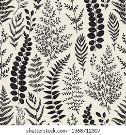 Seamless pattern of leaves and branches silhouettes, hand drawn vector illustration on beige background.