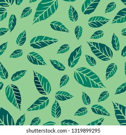Seamless pattern with leaves of green bay leaves on a green background.
