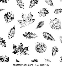 Seamless pattern with leaves imprints. Black and white.