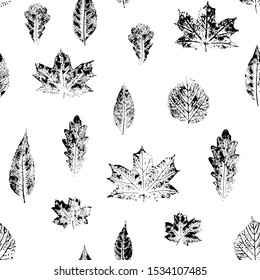 Seamless pattern with leaves imprints. Black and white.