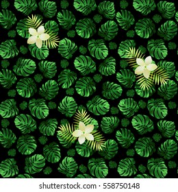 Seamless pattern of leaves monstera and exotic flowers. Dark green background with light blossoms.