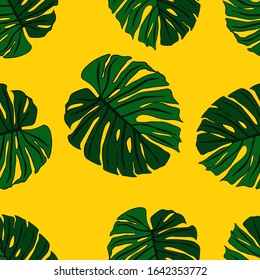 Seamless pattern with the leaves of the monstera . Tropical print on yellow background. Stock vector illustration.