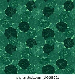 seamless pattern with leaves of nasturtium on green background