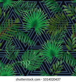 Seamless pattern with leaves of palm trees on a dark background with a triangular ornament