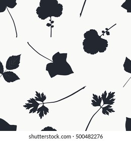 Seamless pattern with leaves silhouette. Background with leaves of herbs, ivy, rose.