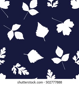 Seamless pattern with leaves silhouette. Herbarium background in white and dark blue colors. Pattern include leaves of birch, rose, different herbs and flowers. 