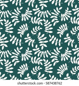 Seamless pattern from leaves and twigs. Chaotic branches