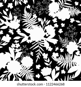 Seamless pattern with leaves. Vector floral set with hand drawn silhouettes of white foliage and flowers on black. Design for prints and textile.