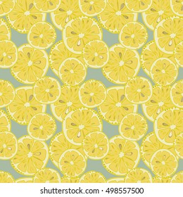  Seamless pattern with lemon slices. Hand drawn citrus fruit parts in yellow color on light blue background.Vector illustration. EPS 8.