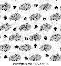 Seamless pattern with leopard and paw marks. Monochrome print for fabric and wrapping paper.