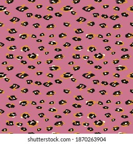
seamless pattern with leopard print on pink background for printing onto fabric, wrapping paper, wallpaper