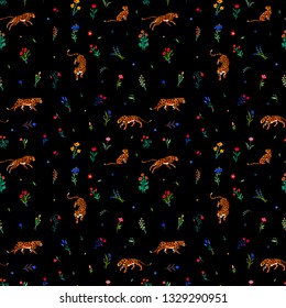 Seamless pattern. Leopard print. Trend print with wild cats. Leopard spots. Wild cats among flowers.