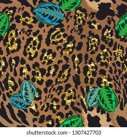 Seamless pattern - leopard skin with gold spangles and tropical leaves.