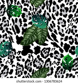 Seamless pattern - leopard skin and tropical leaves.