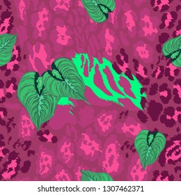 Seamless pattern - leopard skin and tropical leaves.